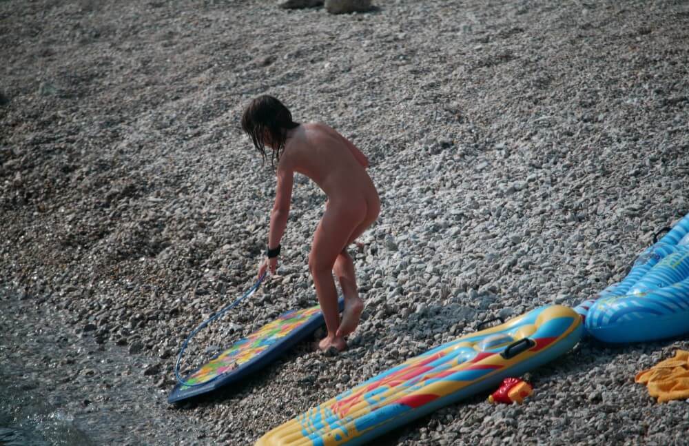 Naturist Surf Board Glides pics - Public nudism