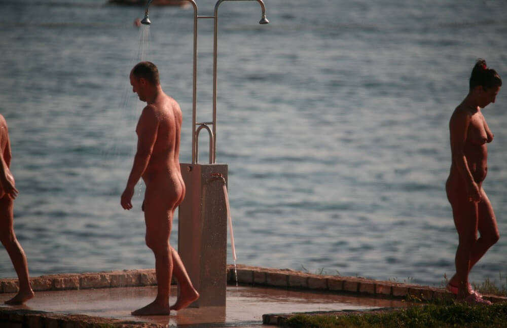 Naturist Shower at Dusk pics - Nudity is perceived as a natural way of life