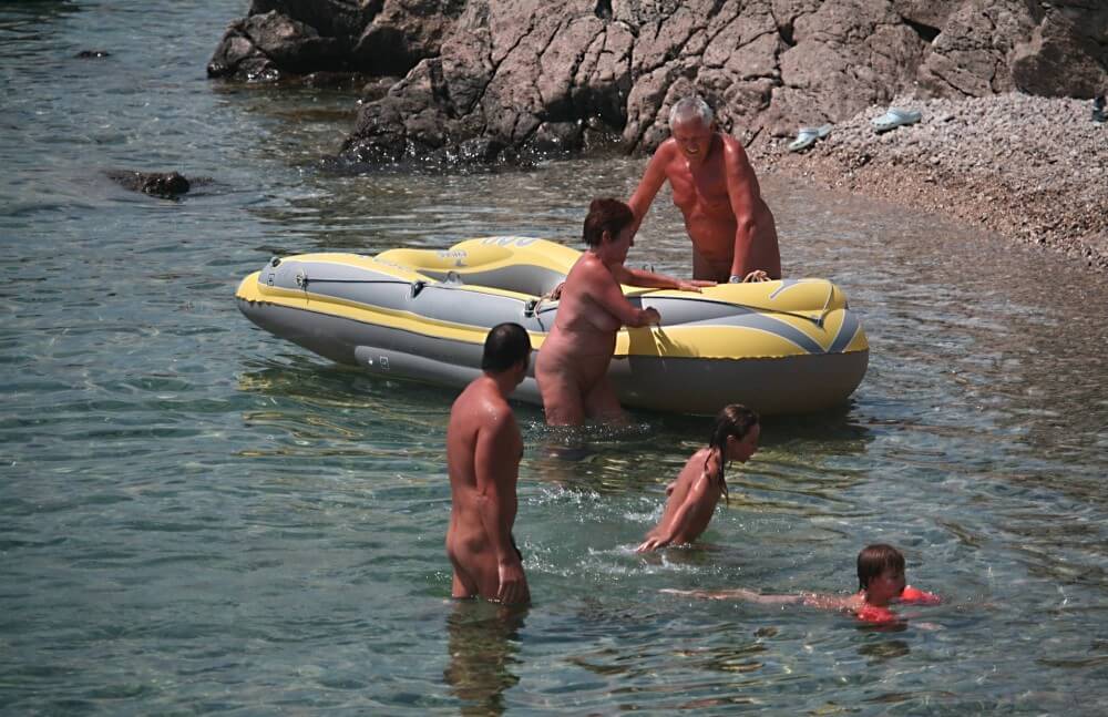 Lone Nudist in Yellow Boat photos - Nudism helps overcome prejudices and fears