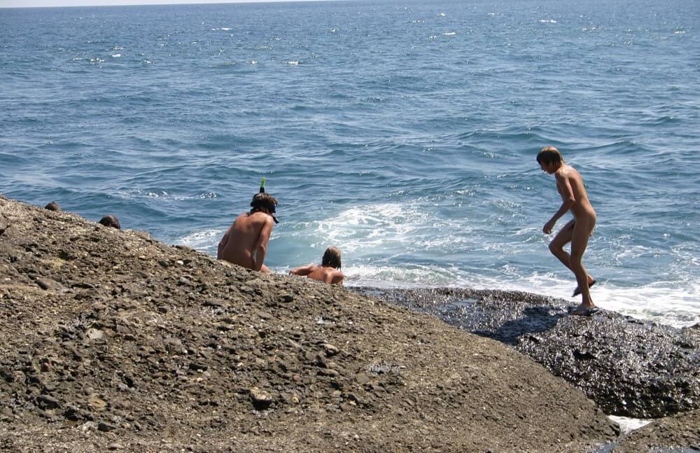 Leaning Against Hit Rocks pics - Nudists strive for inner harmony and peace of mind